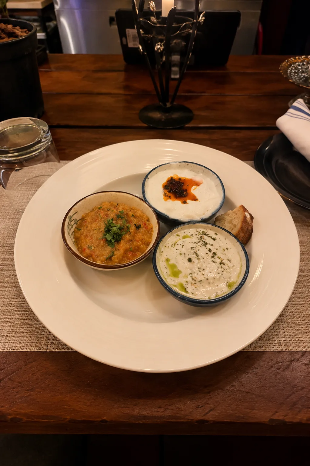 Mediterranean dips and bread on a table at Alesta