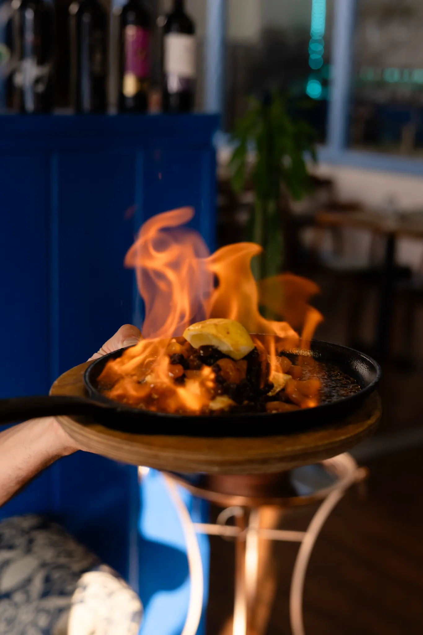 Flaming saganaki served tableside at Kalimera Bar and Grill