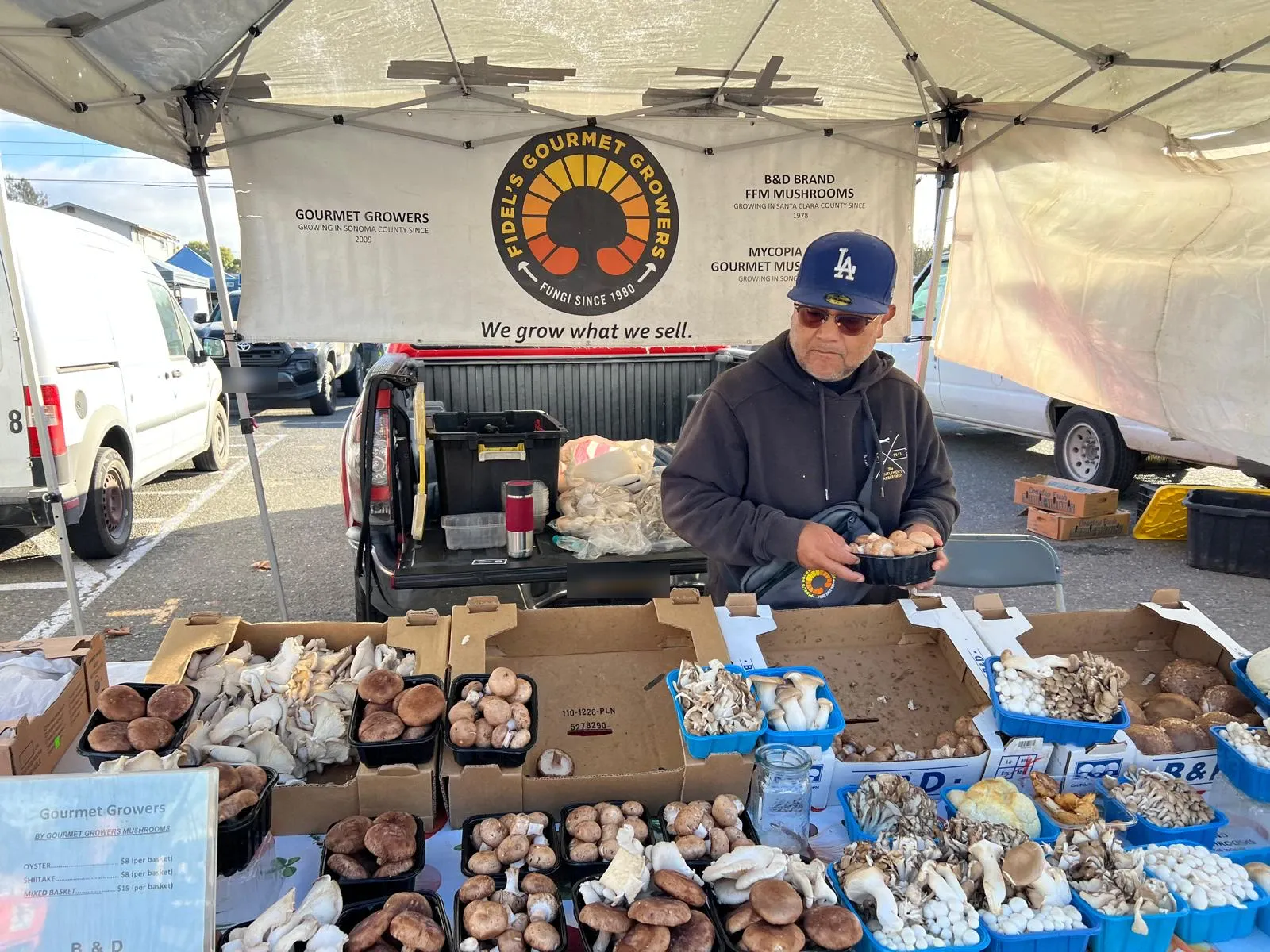 Baskets of oyster, shiitake and other mushrooms on the Fidel's Gourmet Growers table