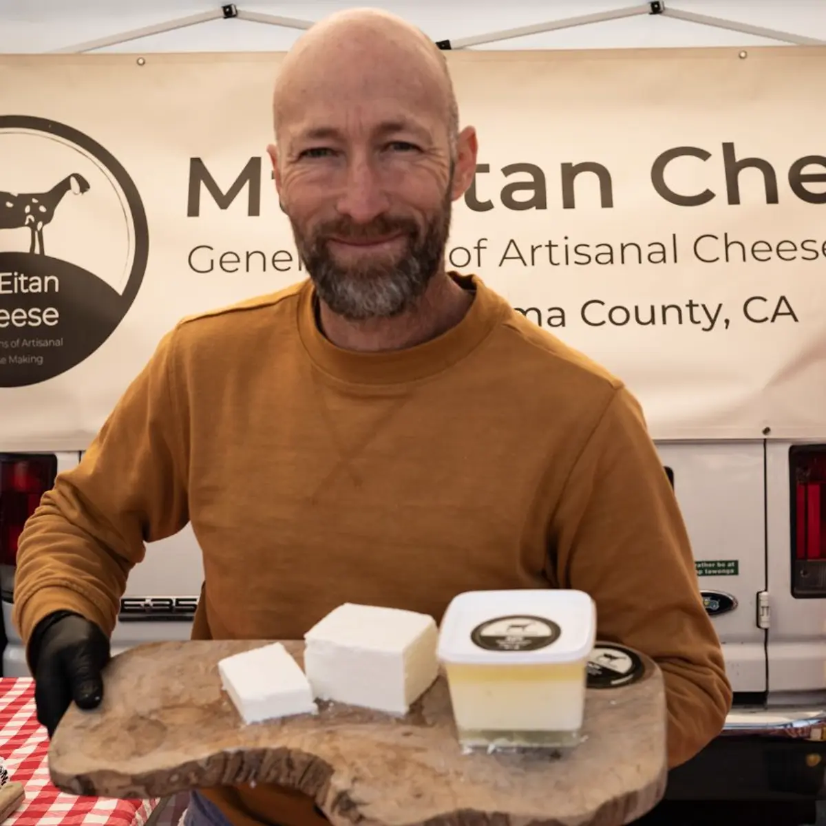 Omer Seltzer at the Mt. Eitan Cheese stand at the Sebastopol Farmers Market