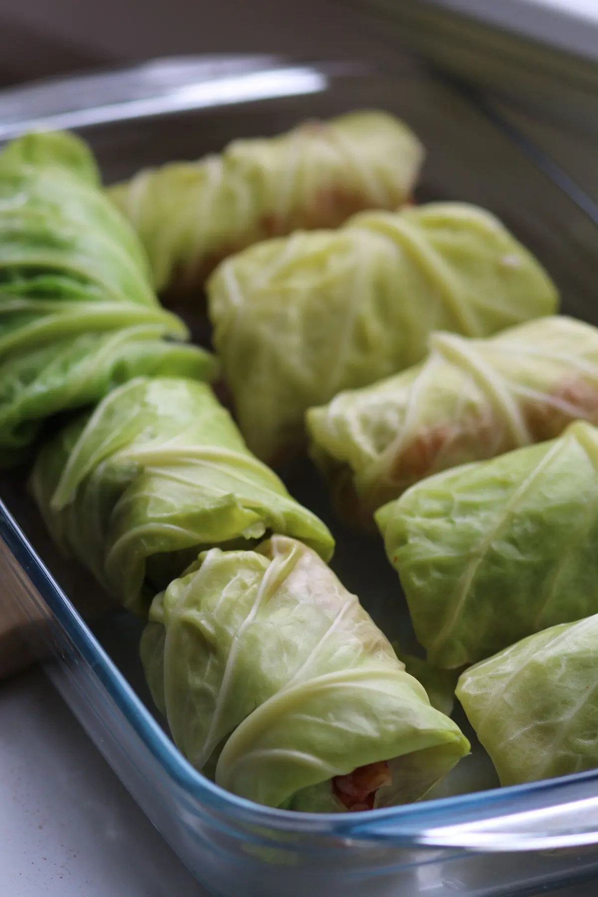 Stuffed cabbage rolls arranged in a baking dish