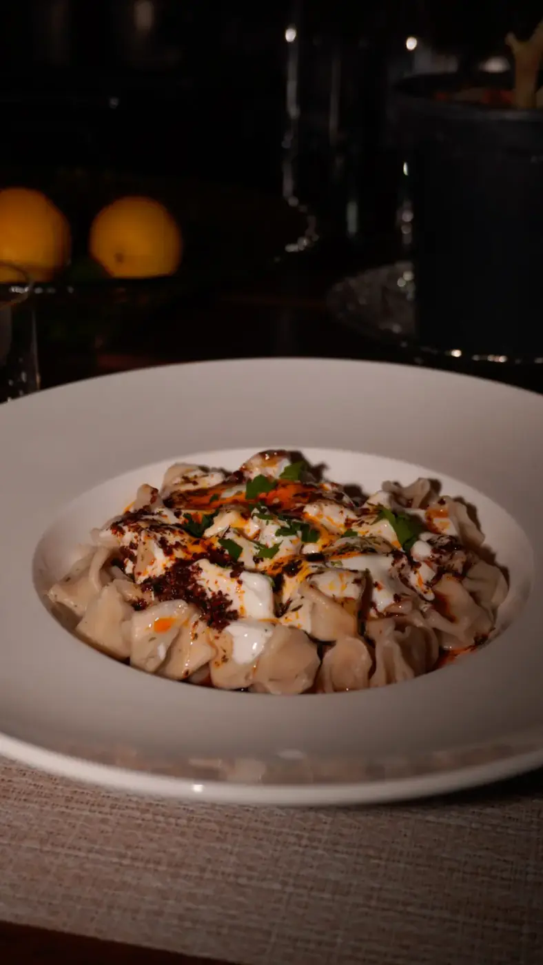 Manti dumplings in sauce at Alesta