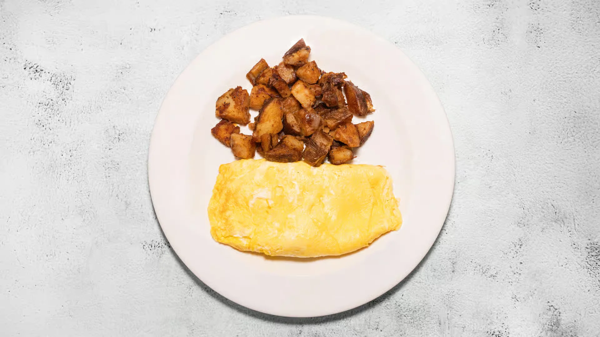 A three-egg diner omelet with home fries at D's Diner