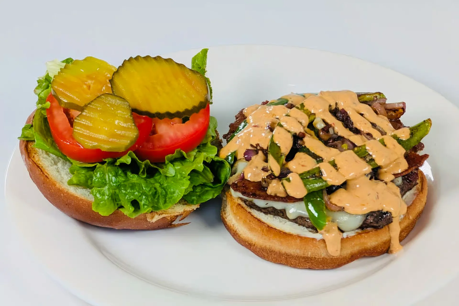 The open-faced Super Caliente Burger with bacon, jalapeños, grilled onions and chipotle sauce
