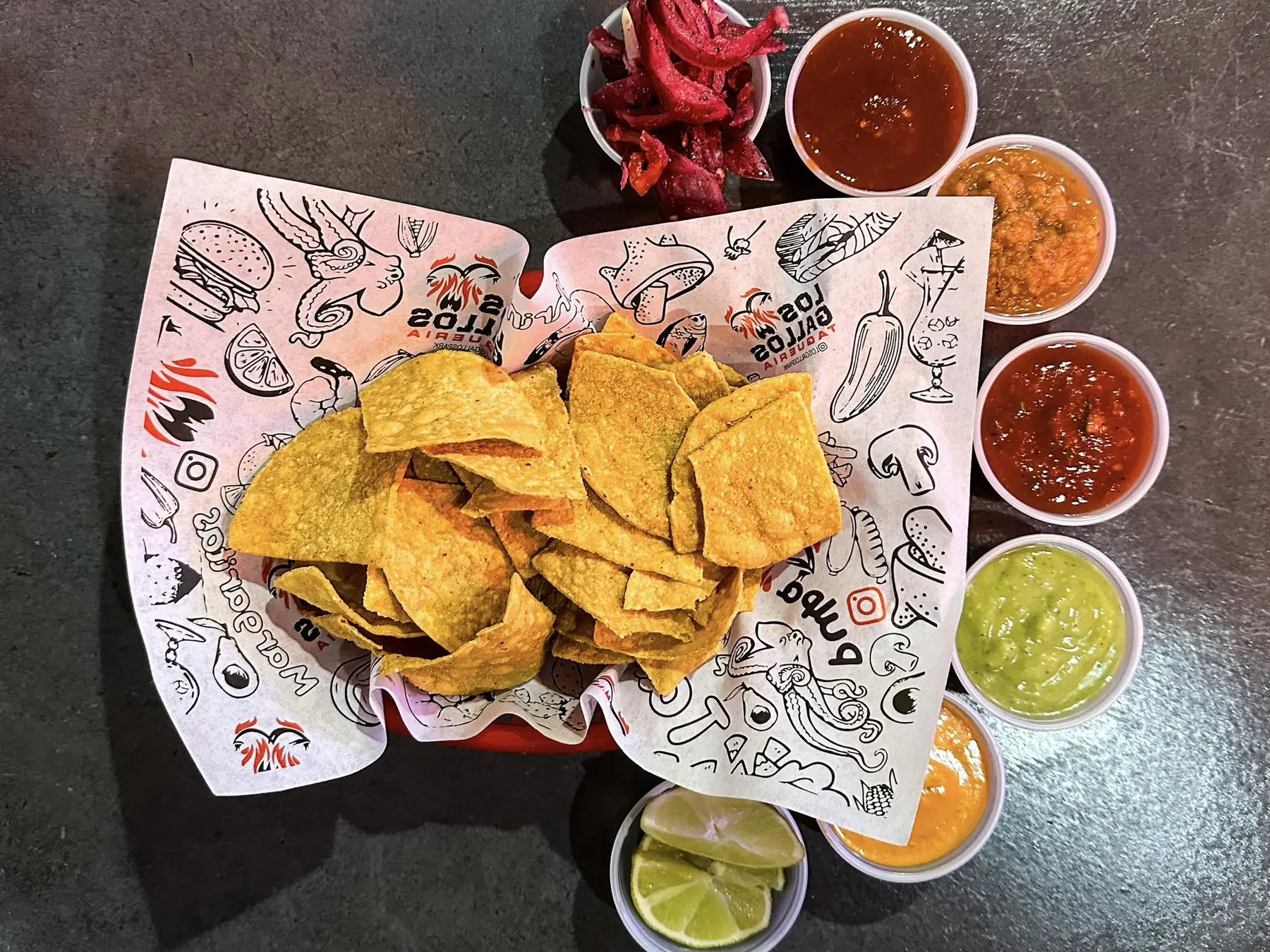 Fresh tortilla chips and several salsas at Los Gallos Taqueria