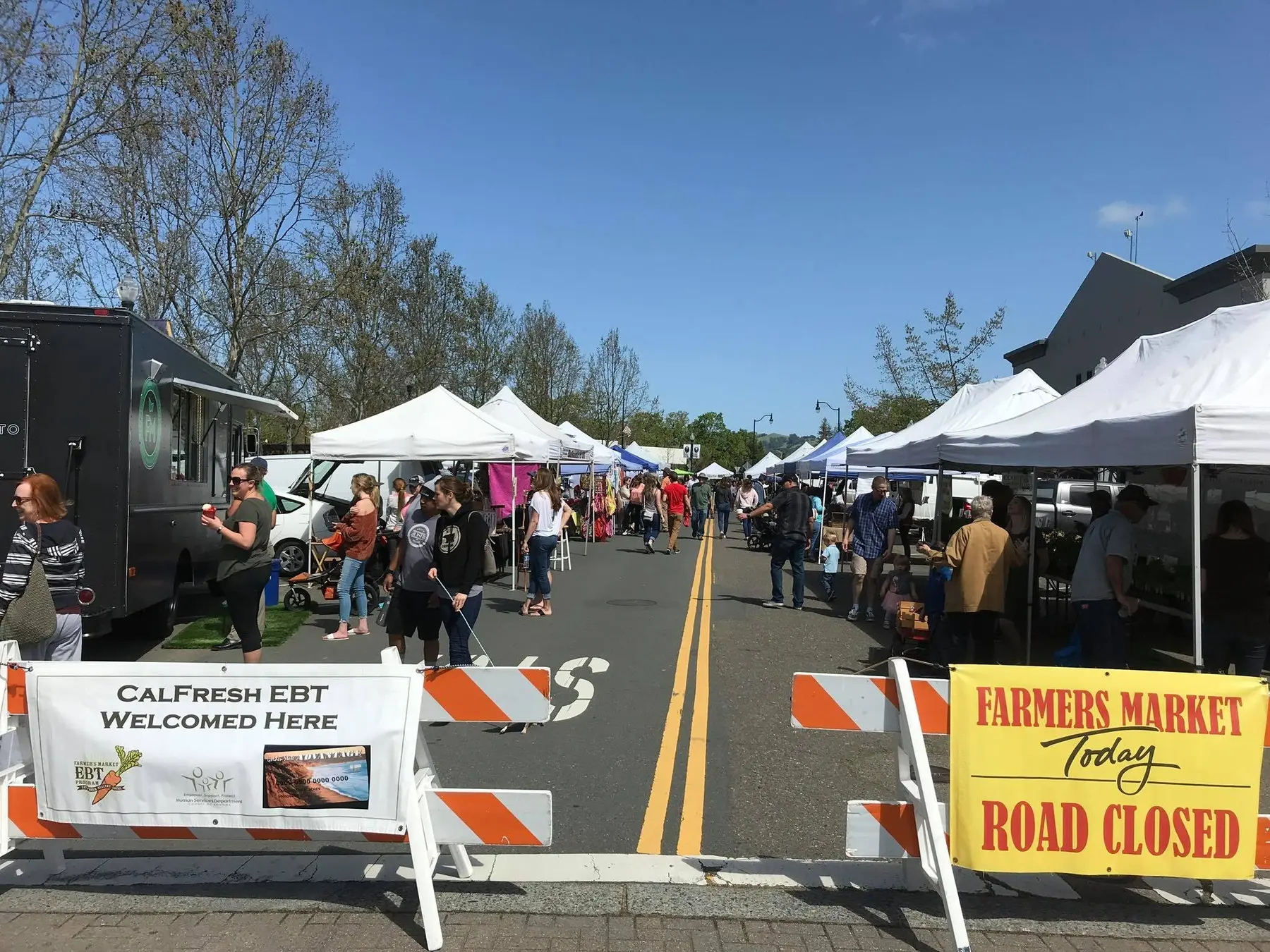 Shoppers and farm tents at Windsor Certified Farmers Market