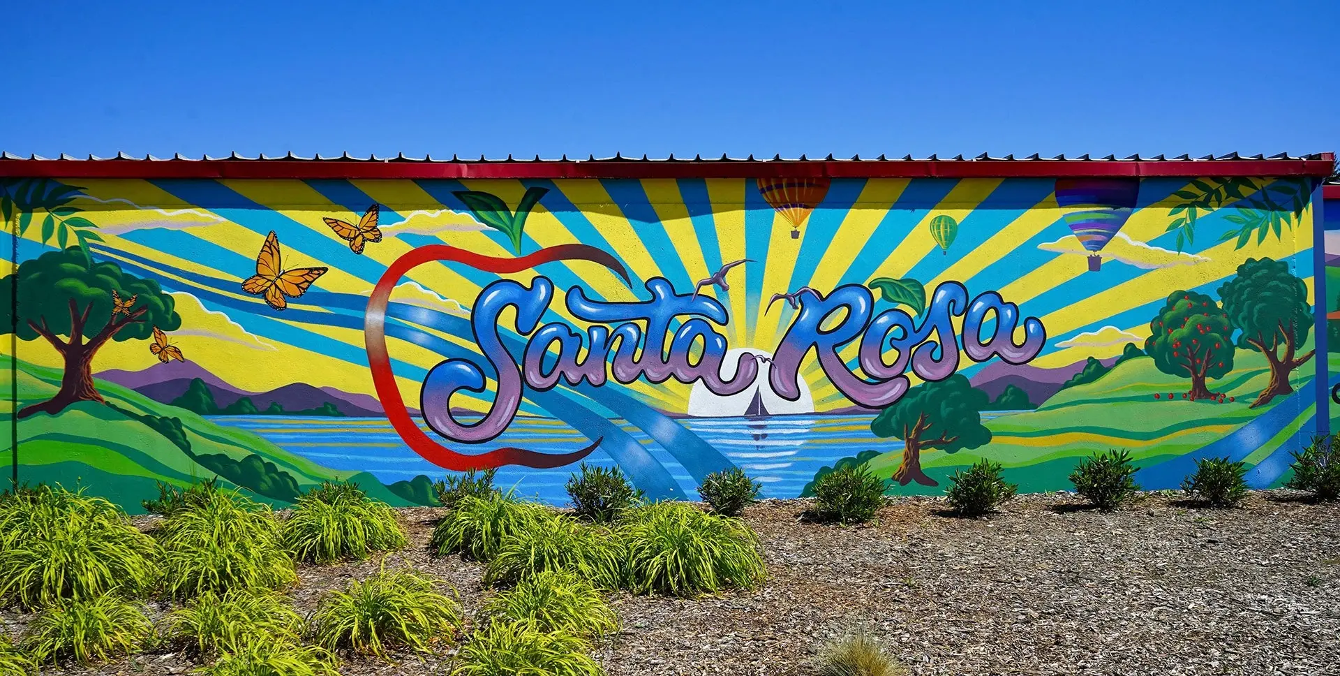 A colorful Santa Rosa mural with mountains, vineyards and the coast