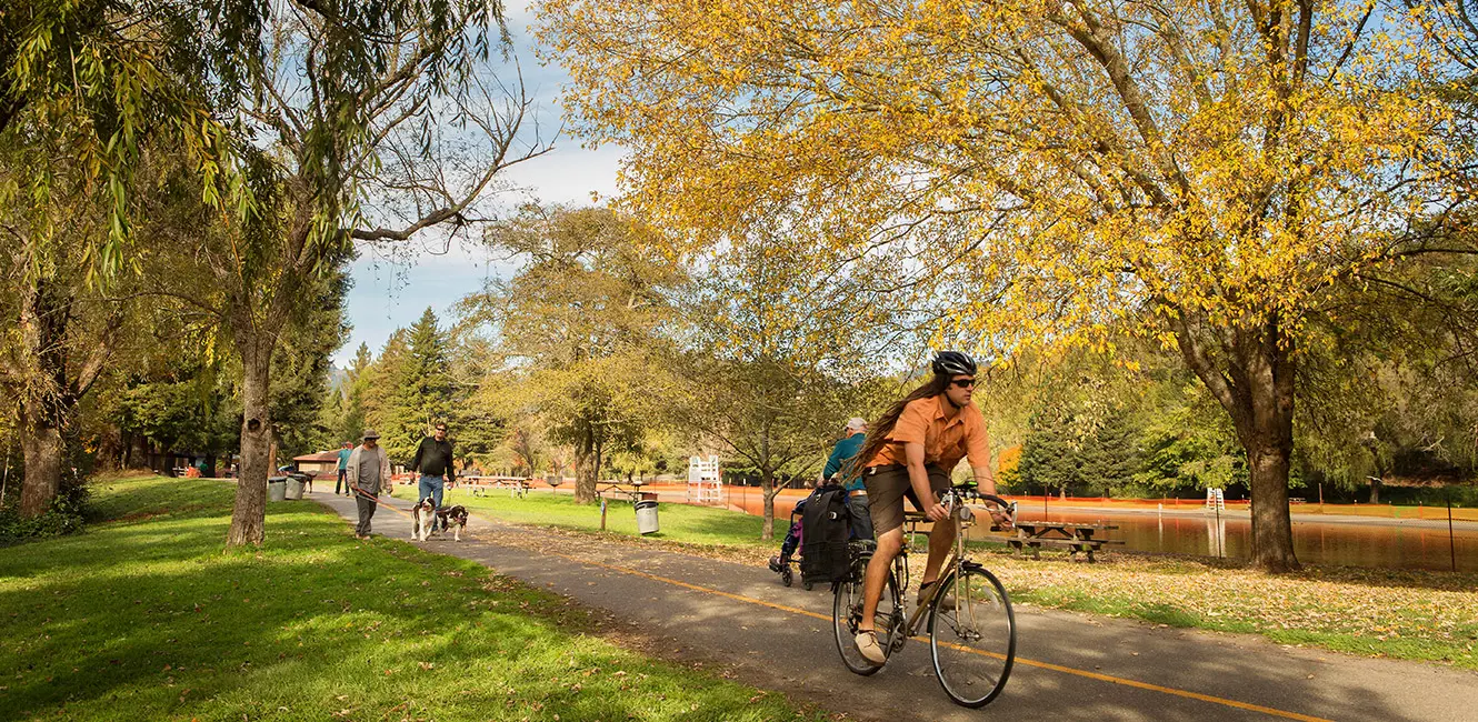 A cyclist on the multi-use trail at Spring Lake Regional Park